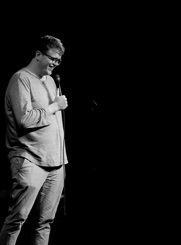 Canaan Whichard on stage during a comedy set